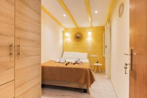 a bedroom with a bed in a small room at Olimpias Nest Corfu in Corfu