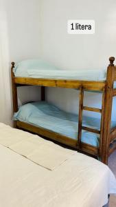 a couple of bunk beds in a room at Casa en Paso De La Patria in Paso de la Patria