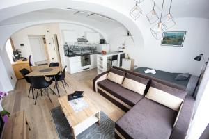 a living room with a couch and a table at Apartment MaRI&BoR in Maribor