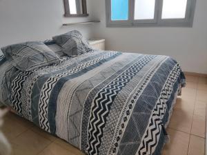 Кровать или кровати в номере Velez Dpto