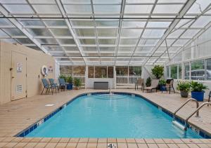 a swimming pool with a roof over it at Peaceful Gatlinburg Downtown Condo - 10 Mins Walk to Main Strip in Gatlinburg