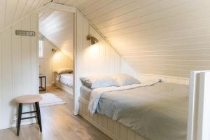 Ένα ή περισσότερα κρεβάτια σε δωμάτιο στο The Buar Cabin