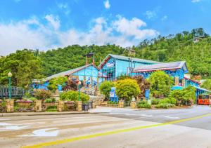 a building on the side of a road with a street at Peaceful Gatlinburg Downtown Condo - 10 Mins Walk to Main Strip in Gatlinburg