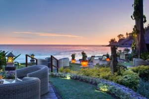 a resort patio with a view of the ocean at Sheraton Senggigi Beach Resort in Senggigi