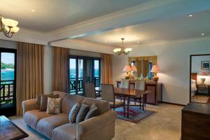 a living room with a couch and a table at Sheraton Senggigi Beach Resort in Senggigi