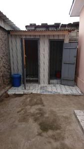 a house being remodeled with a garage at AUBERGE-NGOMSON in Brazzaville