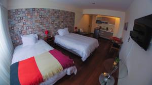 Katil atau katil-katil dalam bilik di Atrium Miraflores Hotel