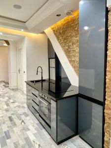 a kitchen with a sink and a counter top at BellaVista walls House in Tangier +3 photos