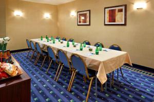 a conference room with a long table and chairs at SpringHill Suites Victorville Hesperia in Hesperia