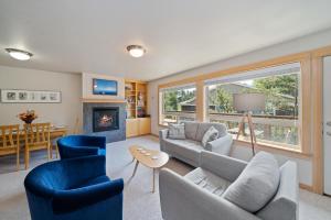 a living room with a couch and chairs and a fireplace at Classic Cottage-MCA #1548 in Manzanita