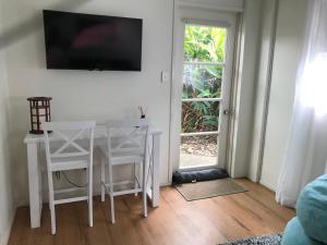 Sjónvarps- og/eða afþreyingartæki á Mudjimba Esplanade Villa