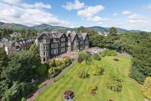 an aerial view of a large house with a green yard at Derwent Manor Apartments & Rooms in Keswick
