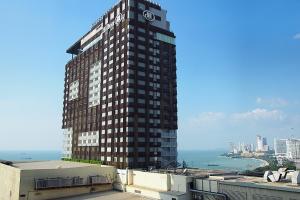 a tall building with a clock on top of it at View Talay 6 by Pat 42 in Pattaya
