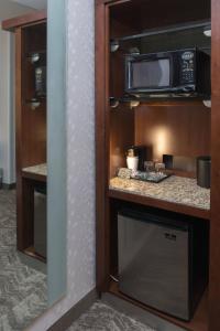a kitchen with a microwave and a counter top at SpringHill Suites by Marriott Logan in Logan
