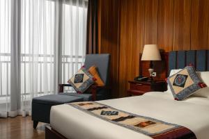 Postel nebo postele na pokoji v ubytování Bamboo Sapa Hotel