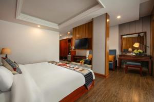 Postel nebo postele na pokoji v ubytování Bamboo Sapa Hotel