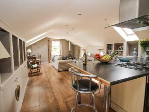a kitchen and living room with a counter top at The Barn in Preesgreen