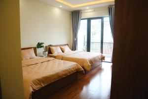 מיטה או מיטות בחדר ב-Anita homestay Dalat