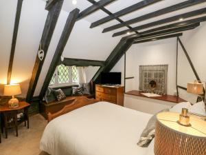 Ліжко або ліжка в номері Hearthstone East Cottage