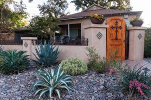 a house with a wooden door and some plants at Cozy Apt-Sequoia Parks Coast Wineries Skiing-All Day Trips in Visalia