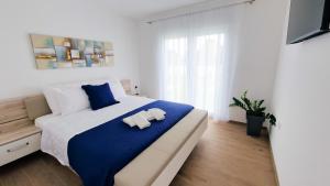 Postel nebo postele na pokoji v ubytování Villa Corona Cordis + 17 fotografií