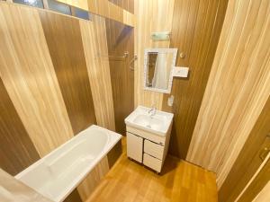 a bathroom with a sink and a toilet and a bath tub at Nazneen Group Of Houseboats in Srinagar