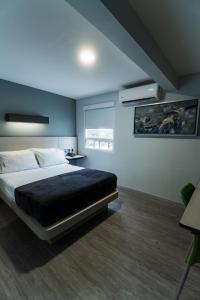 Postel nebo postele na pokoji v ubytování HOTEL LEMON GREEN -Zona Expo Frente al Centro de Convenciones