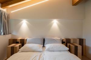 Postel nebo postele na pokoji v ubytování Agritur Deromedi