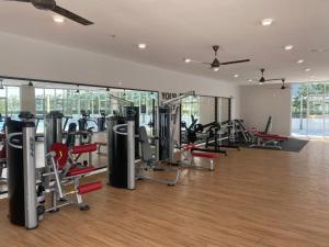 a gym with several treadmills and exercise bikes at KLIA KLIA2 Alanis Sepang Putrajaya Cyberjaya Nilai by 3SIBS in Sepang
