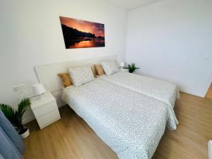 a small bedroom with a bed and a couch at Torres del Sol Playa de Las Vistas FREE WIFI in Playa de las Americas +20 photos