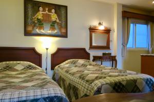 Postel nebo postele na pokoji v ubytování Fulay Hotel