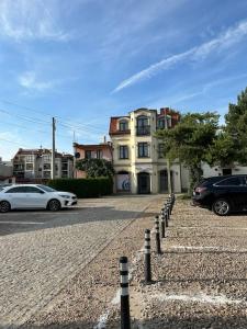 a street with cars parked in front of a building at Salt INN Apartments No 2 - jacuzzi in Wieliczka