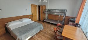 a bedroom with a bed and a bunk bed at Kojo 2 in Władysławowo