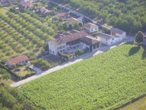 an aerial view of a large house on a hill at Chambres d'Hôtes La Noyeraie in Izeron
