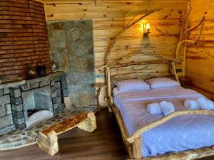 Postel nebo postele na pokoji v ubytování Şira Suit Bungalov