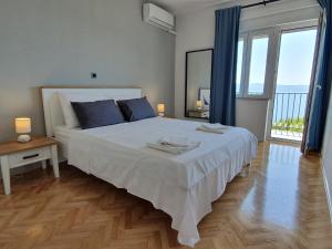 Posteľ alebo postele v izbe v ubytovaní Apartman Oneum