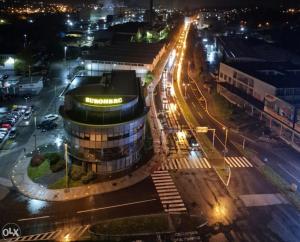 a night view of a building in a city with lights at ArtePovera Apartment Tuzla in Tuzla