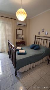 Διαμέρισμα στο Κέντρο της Χίου tesisinde bir odada yatak veya yataklar