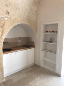 Η κουζίνα ή μικρή κουζίνα στο Dimora Grottacielo