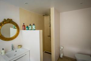 a bathroom with a sink and a mirror at La chambre de Manon in Hesdin +13 photos