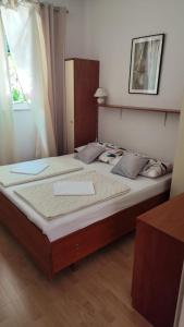 Postel nebo postele na pokoji v ubytování Apartments Suri