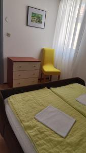 Postel nebo postele na pokoji v ubytování Apartments Suri