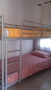 a couple of bunk beds in a room at Villa LLoret Blau in Lloret de Mar