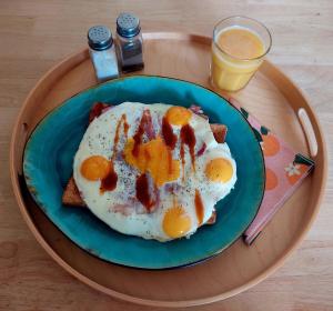 a plate with eggs and toast on a table at Maison du Grand Moulin in Saint-Aubin-en-Charollais +17 photos