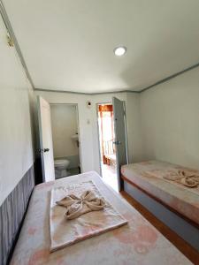 Postel nebo postele na pokoji v ubytování Ander Divers Garden Resort