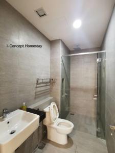 a bathroom with a toilet and a shower and a sink at I-Concept Homestay in Kuala Lumpur