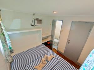 Postel nebo postele na pokoji v ubytování Ander Divers Garden Resort