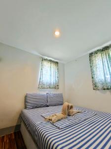 Postel nebo postele na pokoji v ubytování Ander Divers Garden Resort