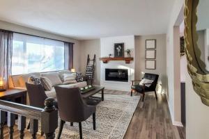 a living room with a couch and a fireplace at Book Entire House, 3 Bedrooms in White Bear Lake in Saint Paul
