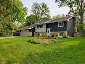 a house with a garden in the yard at Book Entire House, 3 Bedrooms in White Bear Lake in Saint Paul